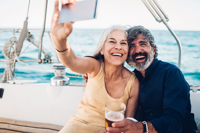 happy couple selfie sailboat